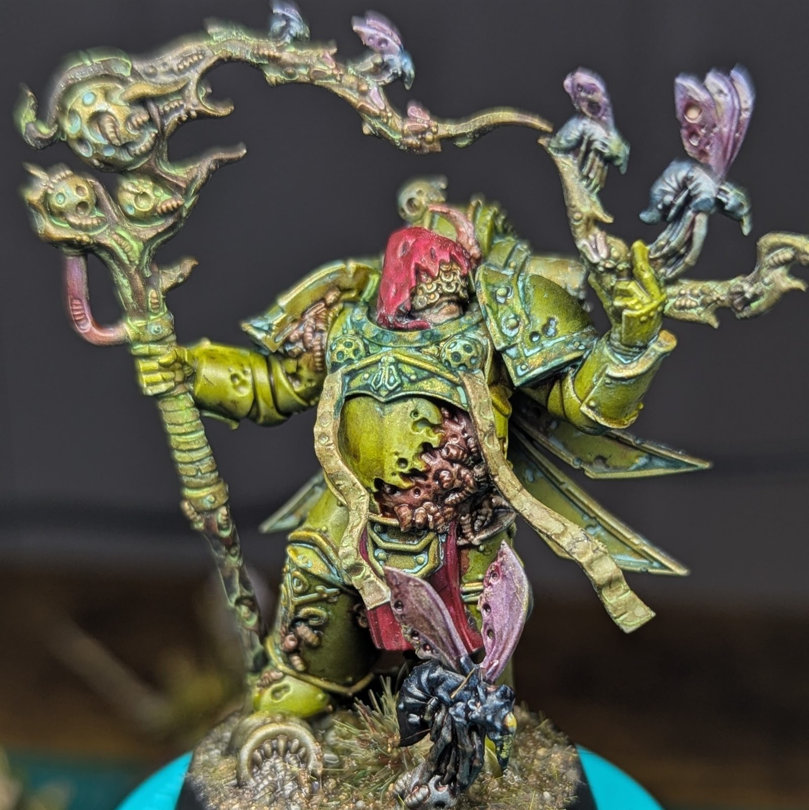 Hand-painted Death Guard miniature in corroded green armor carrying an elaborate branching staff.